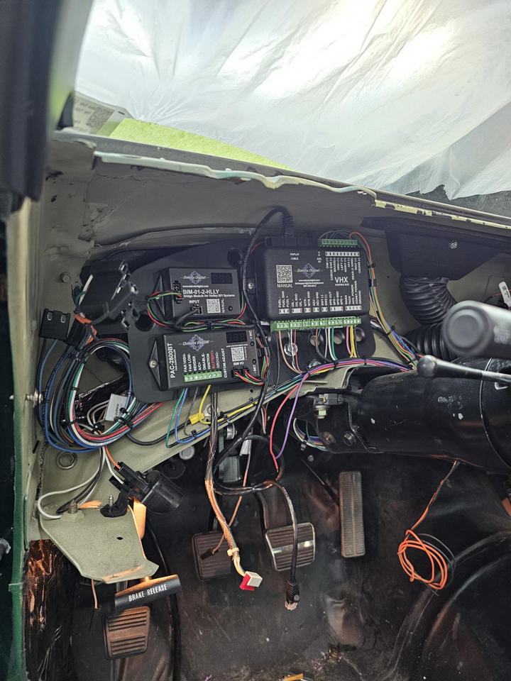 Dakota Digital VHX, PAC-2800BT and Holley bridge modules mounted and wired under a classic dash
